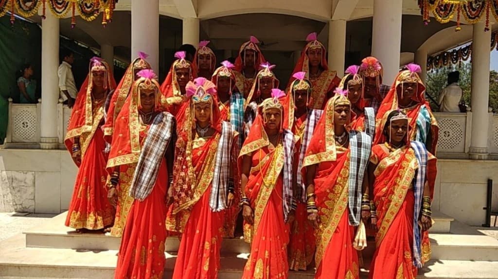 Tribal women in traditional attire at a cultural ceremony